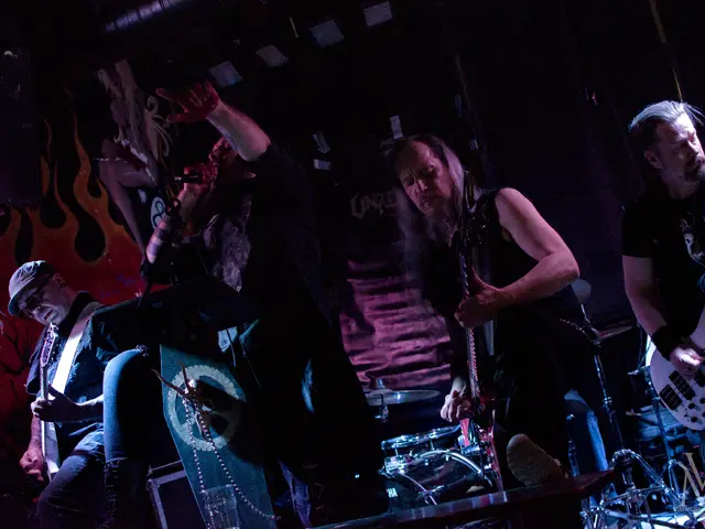 Vocalist behind the coffin lectern with both guitarists and the bassist