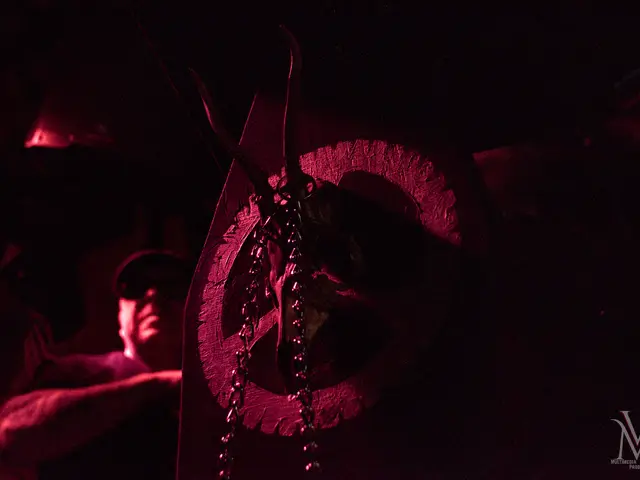 The Emblem on the coffin lectern, chains hanging from the skull