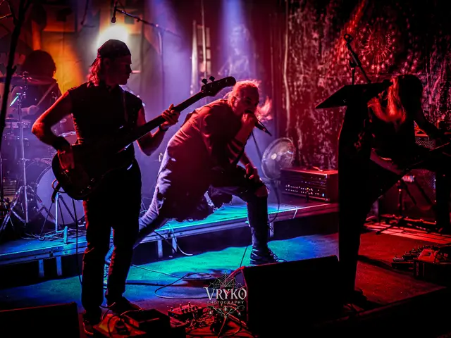 Bassist and vocalist under coloured stage light, the coffin lectern on the right